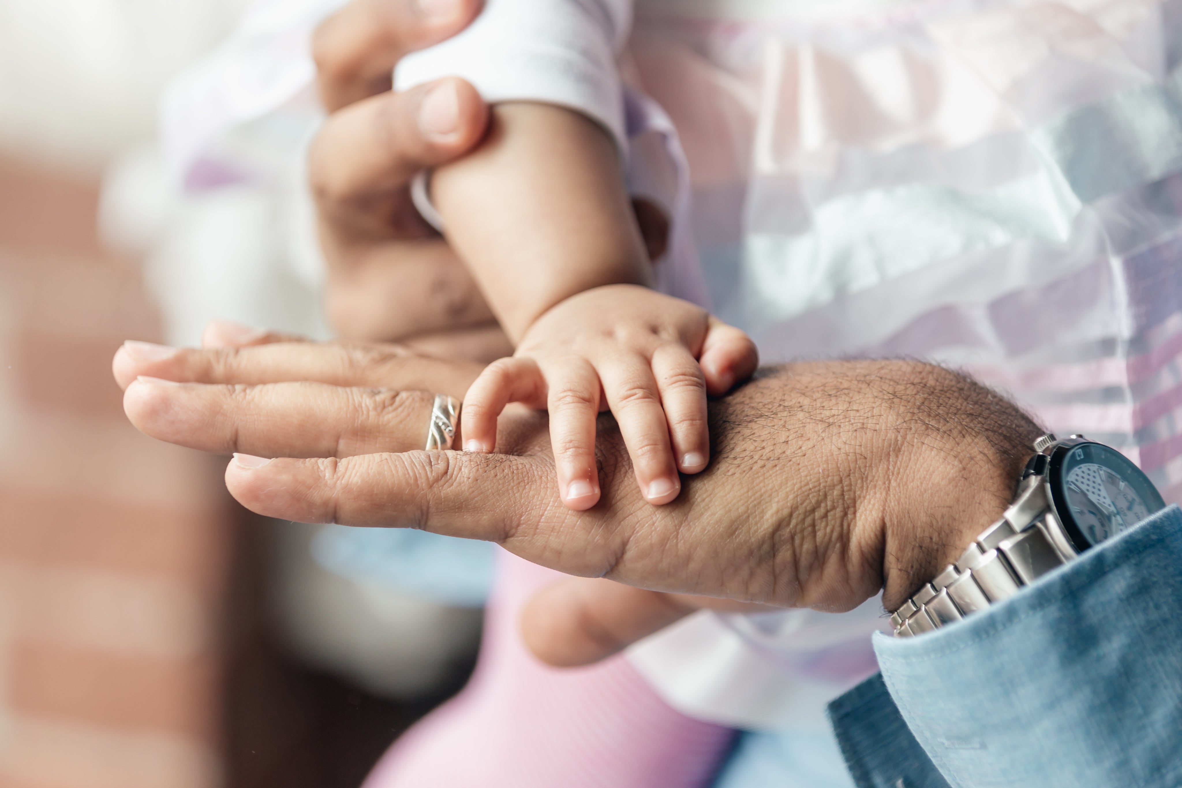 files/baby-girls-hand-on-dads-hand.jpg